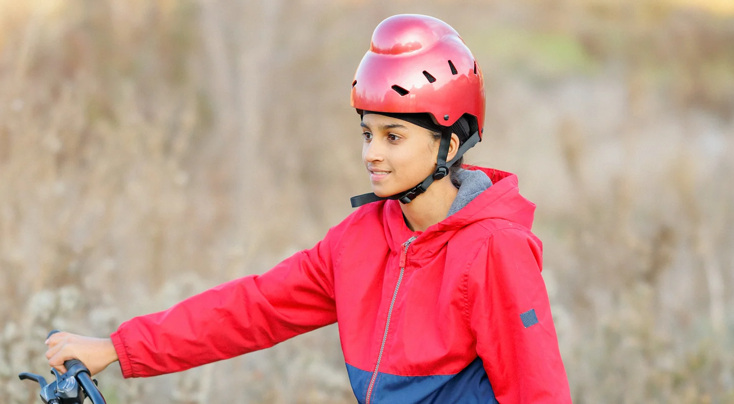 Sikh child wearing bold helmet.