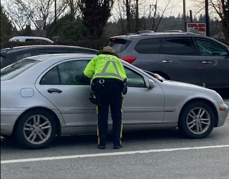 North Van RCMP officer stopping car.