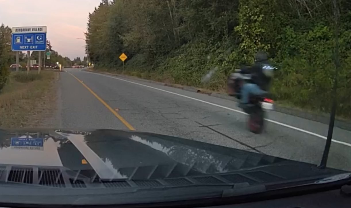 A man doing a wheelie on a motorcycle
