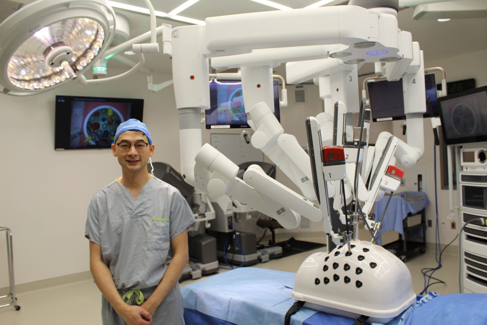 Dr. Justin Lee with Da Vinci Xi surgical robot at Lions Gate Hospital.