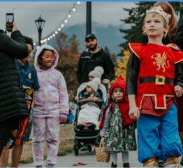 Children in Halloween costumes at an outdoor event